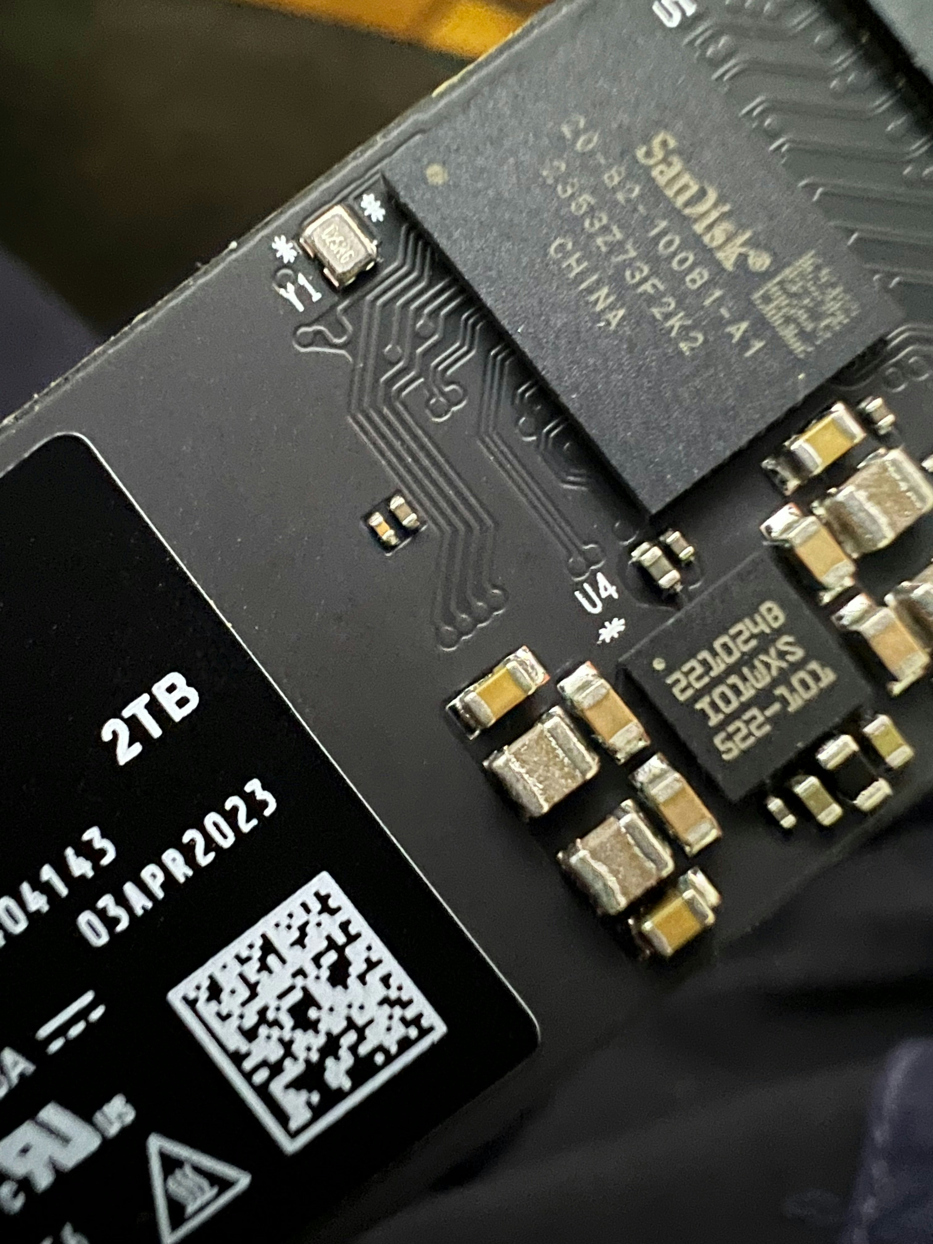 Close-up of solid state drive circuit board showing memory chips and controller